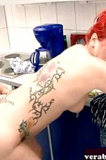 German redhead housewife fucks her husband in the kitchen