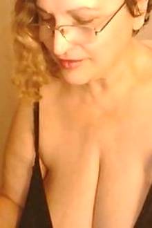 mature sexy mom shows her big tits and suck herself